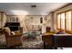 Cozy living room featuring hardwood floors, a sofa, and large windows at 2917 Chapala Dr, Las Vegas, NV 89120