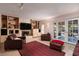 Inviting living room with stone accent wall, built-in shelving, and comfortable seating, great for relaxation at 2917 Chapala Dr, Las Vegas, NV 89120