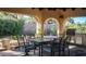 Covered patio boasts an outdoor kitchen and ample dining space, perfect for entertaining guests in style at 2917 Chapala Dr, Las Vegas, NV 89120