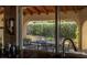 View from the kitchen window shows the outdoor patio with wooden ceiling and furniture at 2917 Chapala Dr, Las Vegas, NV 89120