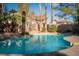 Sparkling pool is surrounded by lush landscaping, creating a private backyard oasis, ready to enjoy at 2917 Chapala Dr, Las Vegas, NV 89120
