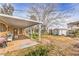 Expansive backyard with covered patio, shed, and ample space for outdoor activities at 3567 Horizon Cir, Las Vegas, NV 89121