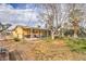 Large backyard featuring covered patio, mature trees, and outdoor living space at 3567 Horizon Cir, Las Vegas, NV 89121