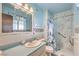 Bathroom featuring a shower, sink, and toilet with unique blue and white decor and vintage details at 3567 Horizon Cir, Las Vegas, NV 89121