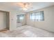 Well-lit bedroom featuring a window, closet with sliding mirrored doors, and plush carpeting at 3567 Horizon Cir, Las Vegas, NV 89121