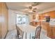 Dining area connecting to kitchen featuring a view into the bright sunroom at 3567 Horizon Cir, Las Vegas, NV 89121