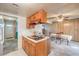 Galley kitchen with gas cooktop island, and adjacent dining area featuring a wall of natural light at 3567 Horizon Cir, Las Vegas, NV 89121
