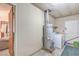 Functional laundry area with washer, dryer, and water heater, offering convenience at 3567 Horizon Cir, Las Vegas, NV 89121