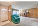 Cozy living room with bright front door and unique wood-paneled accent wall at 3567 Horizon Cir, Las Vegas, NV 89121