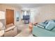 Cozy living room with plush seating, neutral walls, and a door to a bedroom at 3567 Horizon Cir, Las Vegas, NV 89121