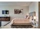 Cozy bedroom featuring a plush bed and a cityscape art piece at 3726 Las Vegas Blvd # 2407, Las Vegas, NV 89158