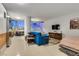 Bright living room featuring a blue sofa, modern furniture, and city views at 3726 Las Vegas Blvd # 2407, Las Vegas, NV 89158