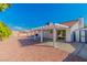 Expansive backyard features a covered patio, shed, and decorative rock for low-maintenance landscaping at 451 Concord Way, Henderson, NV 89015