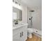 Bathroom features an undermount sink, and walk-in shower with herringbone tile at 451 Concord Way, Henderson, NV 89015