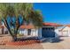 Charming single-story home featuring a red tile roof, neutral stucco, and a well-maintained front yard with mature tree at 451 Concord Way, Henderson, NV 89015