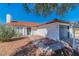 Home exterior features a red tile roof, attached garage, and easy-care rock landscaping at 451 Concord Way, Henderson, NV 89015