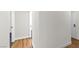Clean and modern hallway featuring hard wood flooring and white trim at 451 Concord Way, Henderson, NV 89015