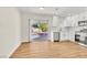 Open-concept kitchen and dining area with sliding glass doors to the backyard at 451 Concord Way, Henderson, NV 89015
