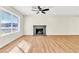 Sunlit living room showcasing a fireplace at 451 Concord Way, Henderson, NV 89015