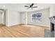 Bright living room featuring a ceiling fan and fireplace at 451 Concord Way, Henderson, NV 89015