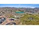 Aerial shot of lake in the community, with playground and tennis courts at 460 Accelerando Way, Henderson, NV 89011