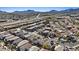 Scenic aerial view of a residential area featuring well-maintained homes, complemented by mountain views and a clear sky at 460 Accelerando Way, Henderson, NV 89011