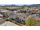 Aerial view of a backyard with artificial grass, patio, outdoor dining set, and barbecue grill, perfect for relaxation at 460 Accelerando Way, Henderson, NV 89011