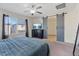 Primary bedroom features large window, TV, and sliding barn door at 460 Accelerando Way, Henderson, NV 89011