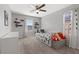 Well-lit bedroom with a daybed, toy storage, and decorative shelves at 460 Accelerando Way, Henderson, NV 89011