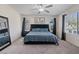 Primary bedroom features a cozy sitting area and carpeted floors at 460 Accelerando Way, Henderson, NV 89011