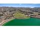 Picturesque community view showcasing a vibrant turquoise lake with an amphitheater and walking trails, blending nature and recreation at 460 Accelerando Way, Henderson, NV 89011