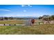 Picturesque park view with vibrant green lawns, modern signage, and distant mountain scenery, promoting community spirit at 460 Accelerando Way, Henderson, NV 89011
