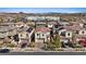 Aerial view of a suburban neighborhood featuring well-maintained homes, desert landscape, and mountain views in the background at 460 Accelerando Way, Henderson, NV 89011