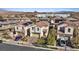 Aerial view of a residential neighborhood showcasing well-maintained homes with front yards and tree-lined streets at 460 Accelerando Way, Henderson, NV 89011