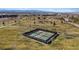 Aerial view of neighborhood park featuring meticulously maintained pickleball courts with city views at 460 Accelerando Way, Henderson, NV 89011