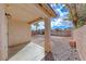 Covered patio area with desert landscaping, rock ground cover, and privacy wall at 4837 Morning Splash Ave, Las Vegas, NV 89131