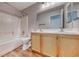 Bathroom featuring a vanity with double sinks and a shower-over-tub at 4837 Morning Splash Ave, Las Vegas, NV 89131