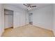 Bedroom featuring a ceiling fan, closet, and doorway to another room at 4837 Morning Splash Ave, Las Vegas, NV 89131