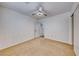 Cozy bedroom offering carpet, a ceiling fan, and closet at 4837 Morning Splash Ave, Las Vegas, NV 89131