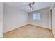 Carpeted bedroom with a ceiling fan and natural light from a window at 4837 Morning Splash Ave, Las Vegas, NV 89131