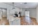 Eat-in kitchen featuring white cabinets, stainless steel appliances, laminate counters, and a sliding glass door at 4837 Morning Splash Ave, Las Vegas, NV 89131