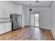 Modern kitchen featuring sleek stainless steel appliances and hardwood floors, offering stylish functionality at 4837 Morning Splash Ave, Las Vegas, NV 89131