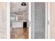 Modern kitchen featuring white cabinets, wood-look floors and stainless steel appliances, as viewed from the doorway at 4837 Morning Splash Ave, Las Vegas, NV 89131