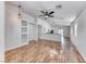 Open concept living space featuring hardwood floors and integrated kitchen view for modern living at 4837 Morning Splash Ave, Las Vegas, NV 89131