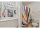 Bathroom with white vanity, bright mirror, and a vibrant shower curtain at 4861 S Torrey Pines Dr # 106, Las Vegas, NV 89103