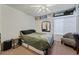 Bedroom featuring a large window, closet, and neutral decor at 4861 S Torrey Pines Dr # 106, Las Vegas, NV 89103