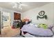 Bedroom with crib, decorations, and view into the bathroom at 4861 S Torrey Pines Dr # 106, Las Vegas, NV 89103