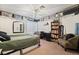 Bedroom with storage shelves, desk, and cozy sitting area at 4861 S Torrey Pines Dr # 106, Las Vegas, NV 89103