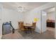 Dining area features a round wooden table, 4 chairs, and neutral wall color at 4861 S Torrey Pines Dr # 106, Las Vegas, NV 89103