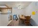 Bright dining area with wooden table, chairs, and ceiling fan at 4861 S Torrey Pines Dr # 106, Las Vegas, NV 89103